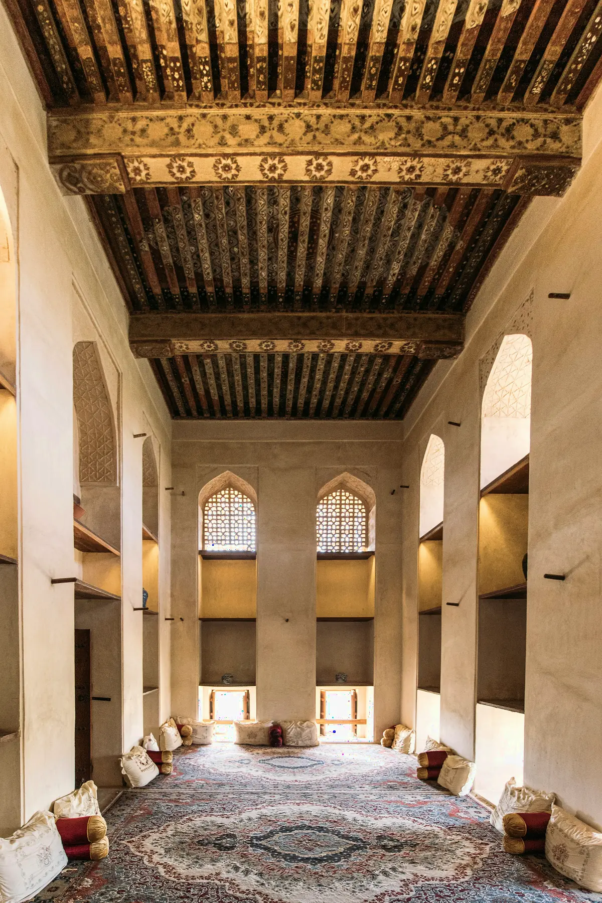 A traditional Arabic hall with a painted wooden ceiling